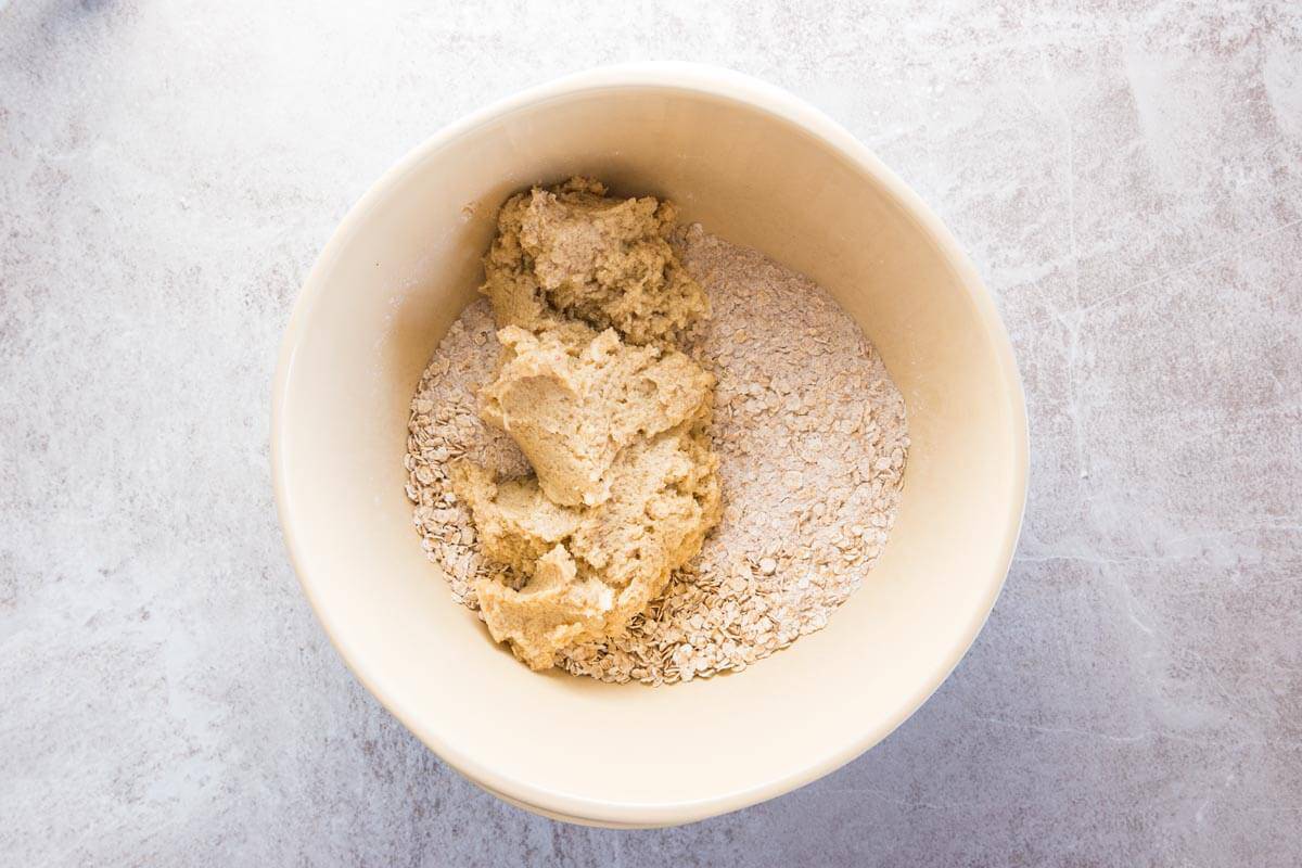 Wet ingredients and dry ingredients for oatmeal cookie dough.