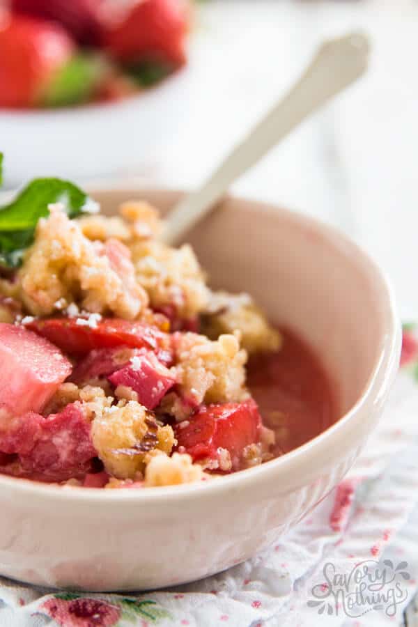 strawberry rhubarb crisp in light pink bowl