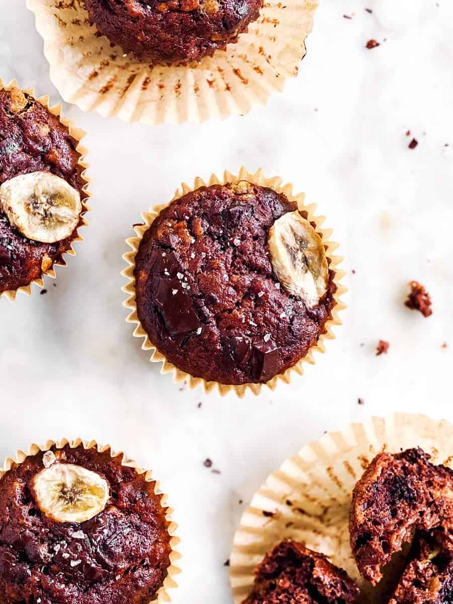 overhead view of chocolate banana muffin on marble surface