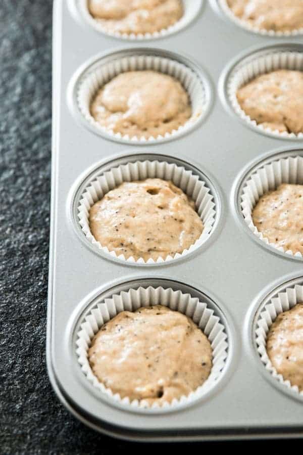 unbaked lemon poppy seed muffin batter in muffin pan