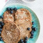 overhead view on blue plate with healthy pancakes on it