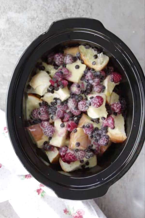 black crock from a slow cooker filled with raspberry French toast