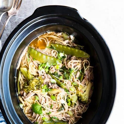 top down view on crock with asian pork noodles