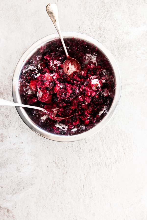 top down view on metal bowl with berry cobbler mix