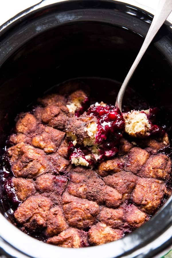 angled view on berry cobbler in crock