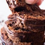 female hand grabbing slice of chocolate banana bread