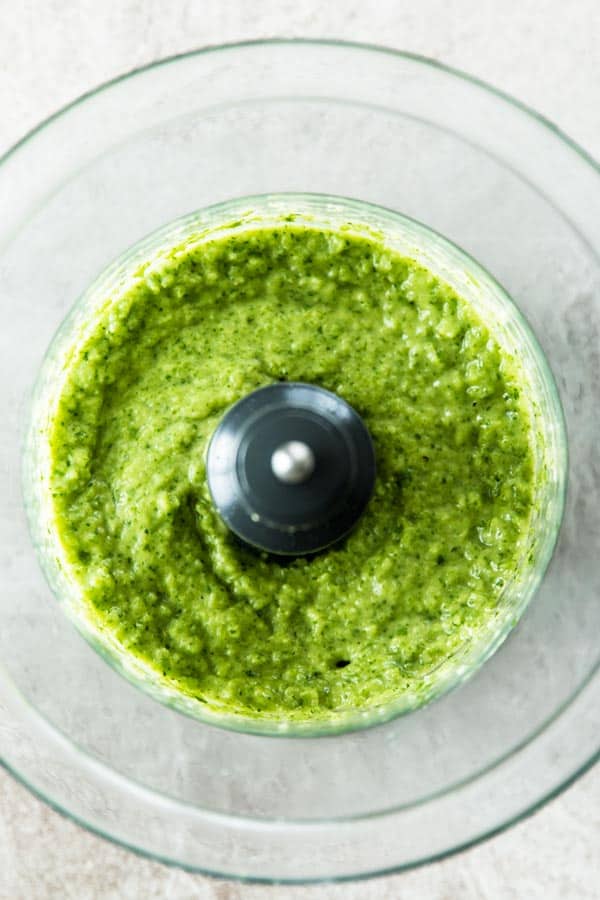top down view on food processor bowl with avocado dipping sauce