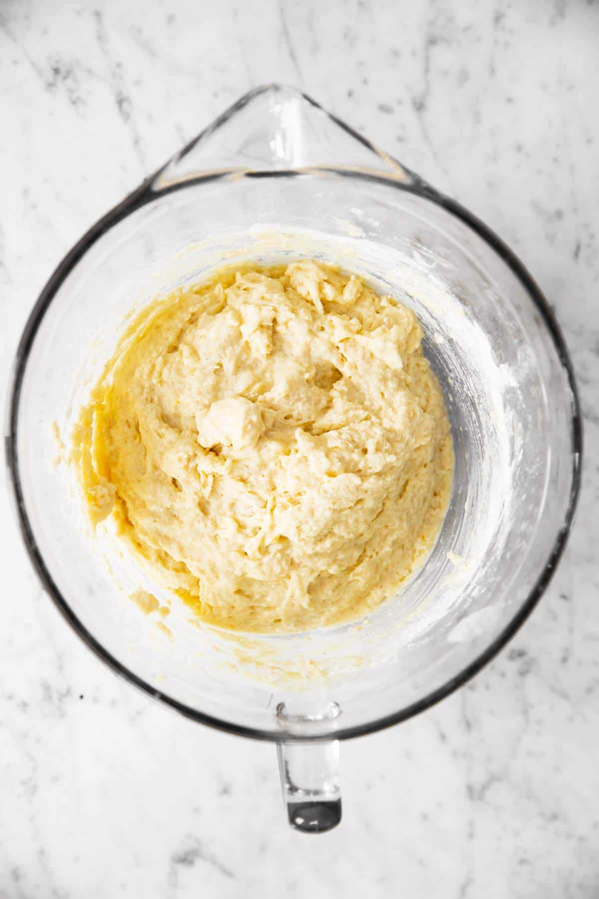 glass bowl with plain muffin batter