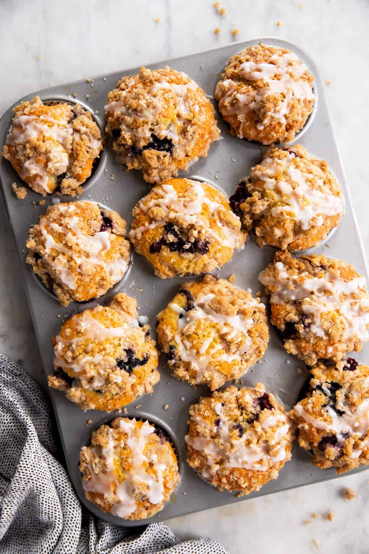 overhead view of baked blueberry muffins in muffin pan