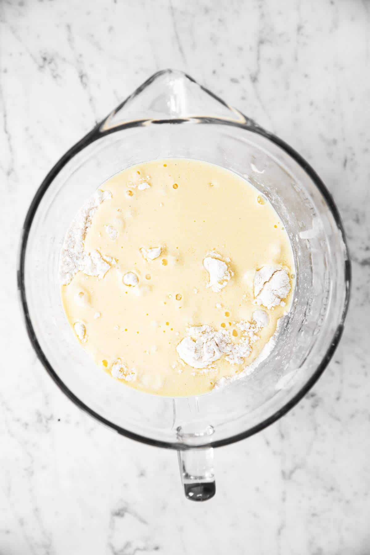 glass bowl with ingredients for muffin batter