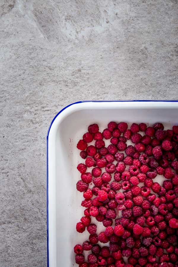 Fresh raspberries on a tray.