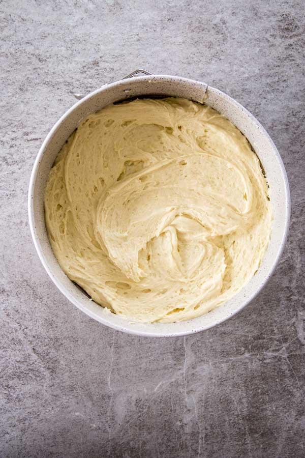 Batter for yogurt raspberry cake in cake tin.