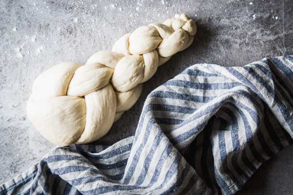 Challah bread braided and ready for the second rise.