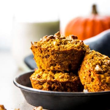 stacked pumpkin oatmeal cups on black dish