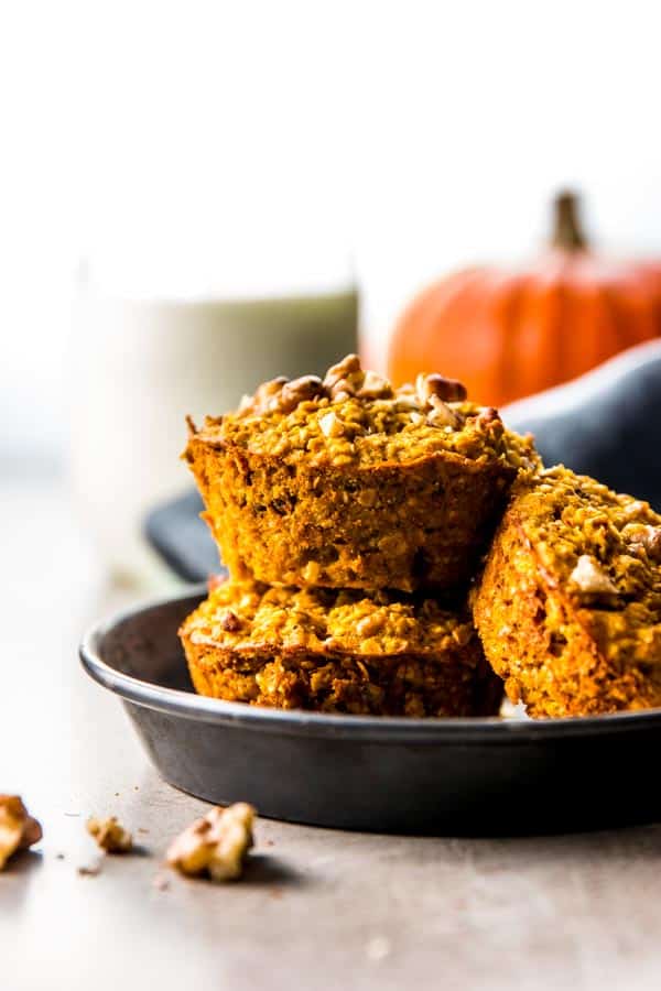 stacked pumpkin oatmeal cups on black dish