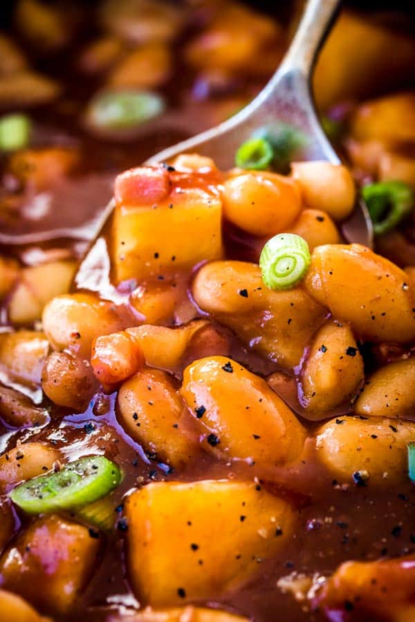 close up of a spoonful of baked beans