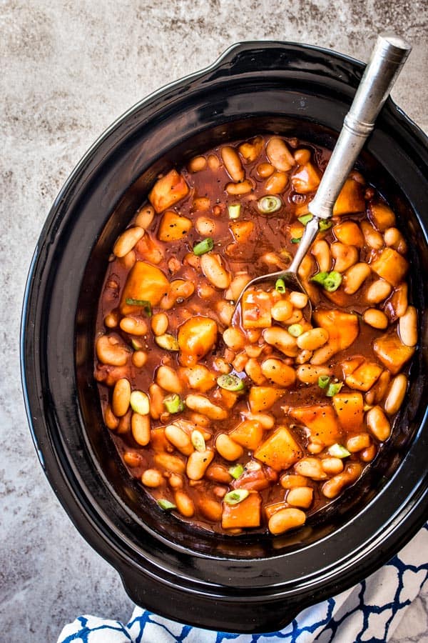overhead view on crock filled with pineapple bbq baked beans