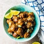 overhead view of honey garlic meatballs in blue bowl