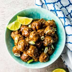 overhead view of honey garlic meatballs in blue bowl