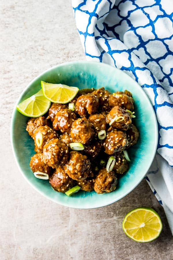 overhead view of honey garlic meatballs in blue bowl