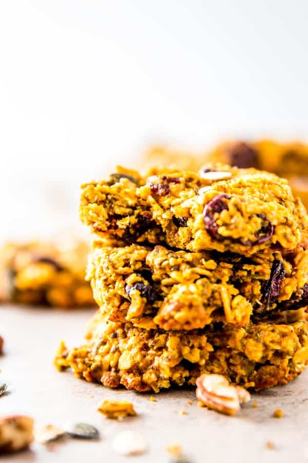 stack of three pumpkin breakfast cookies, top one with bite taken out