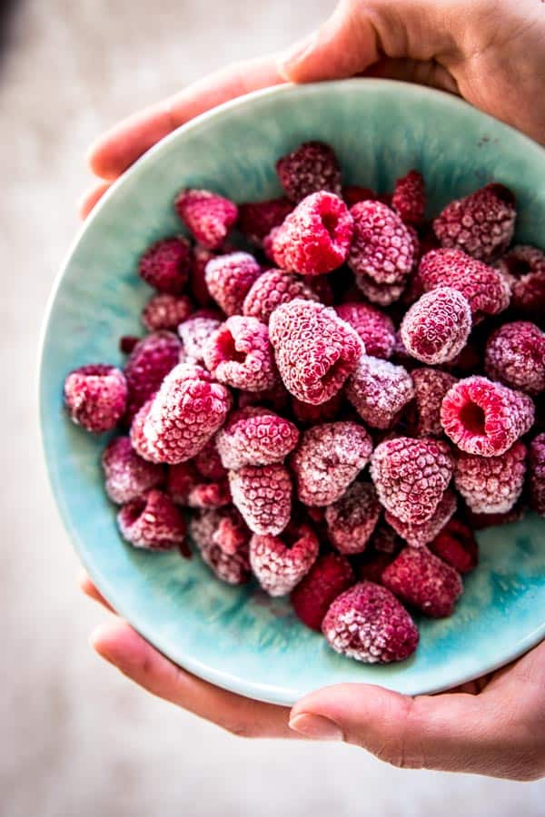 Frozen raspberries in a bowl.