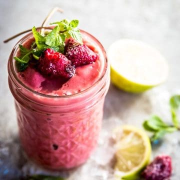 angled view on jam jar with raspberry mango smoothie