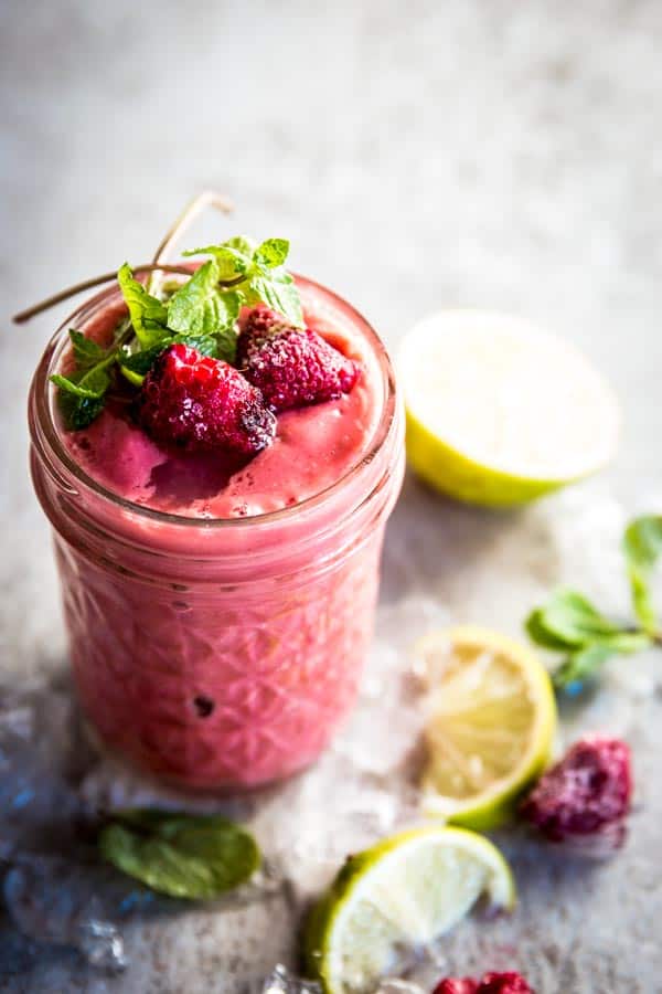 angled view on jam jar with raspberry mango smoothie