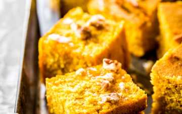 sliced pumpkin cornbread on metal tray