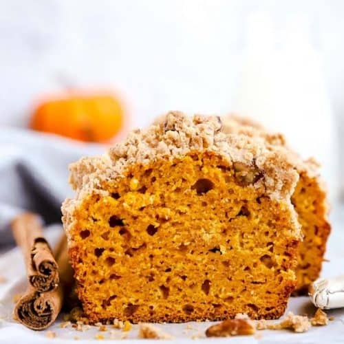 sliced loaf of pumpkin bread on a wooden board