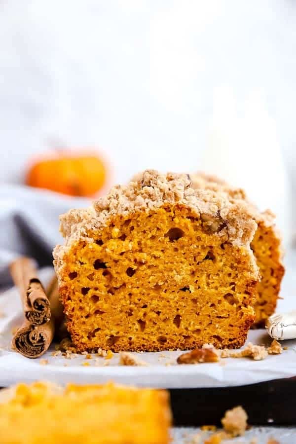 sliced loaf of pumpkin bread on a wooden board