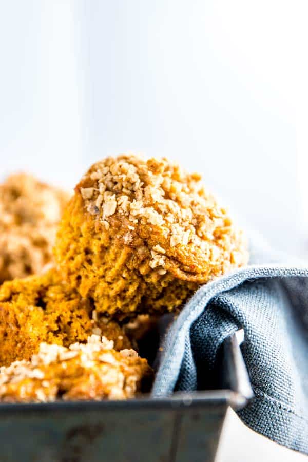 healthy pumpkin muffins in a dish with a dark napkin