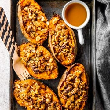 overhead view of black aluminum pan with twice baked sweet potato skins