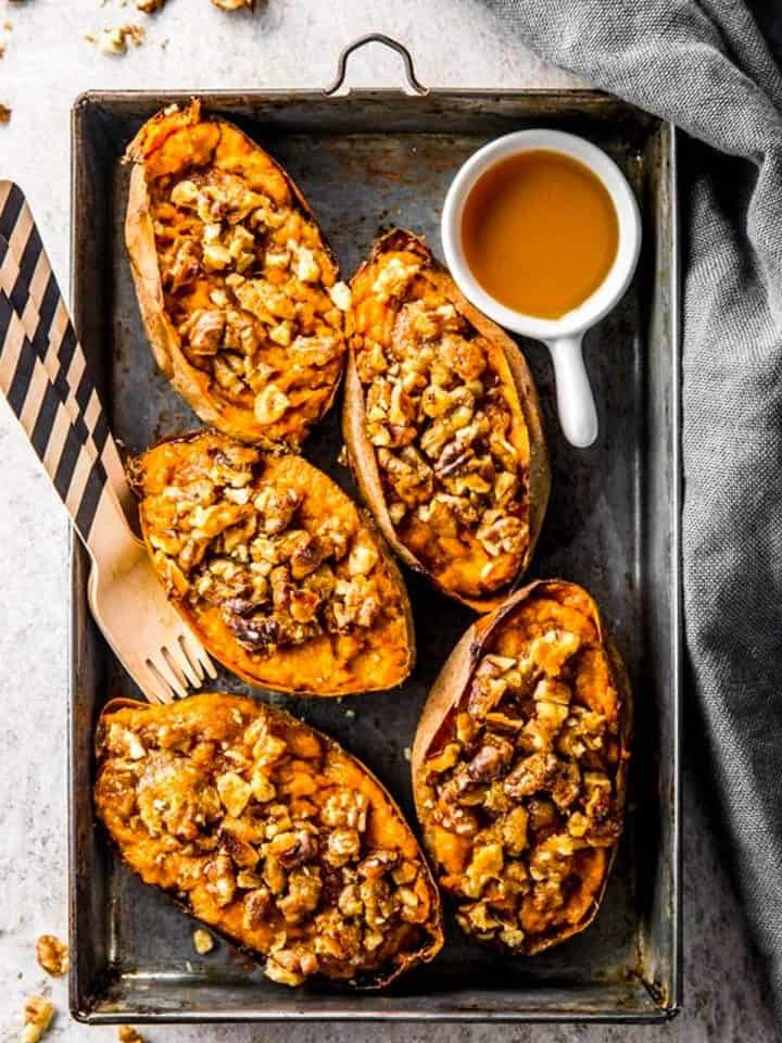 overhead view of black aluminum pan with twice baked sweet potato skins
