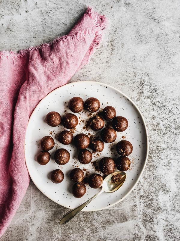 overhead view of white plate with gingerbread energy bites