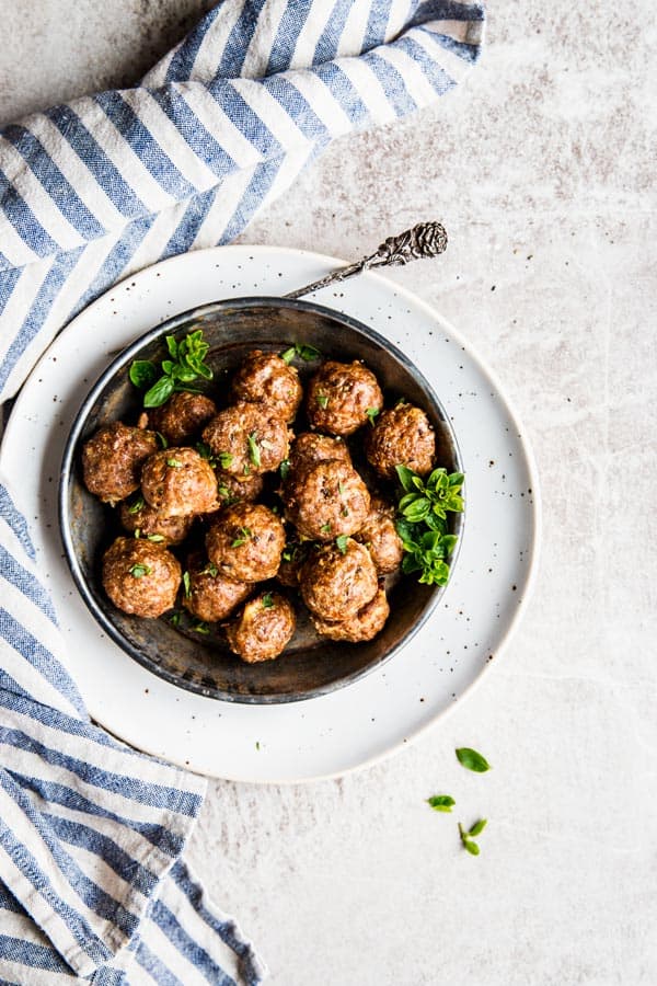 Oven baked meatballs in a bowl, ready to be served.