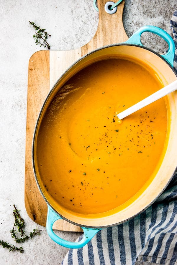 overhead view of Dutch oven filled with pumpkin soup