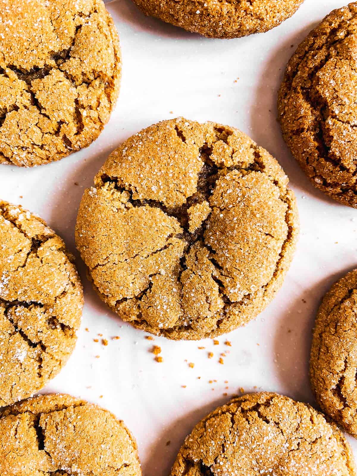 close up photo of ginger molasses cookie on white platter