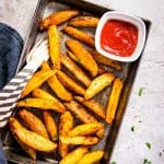 Baked potato wedges on a baking tray