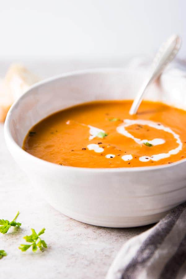 Easy tomato soup in a pottery bowl.