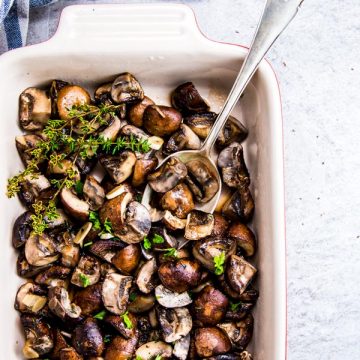 Garlic Butter Mushrooms in a Le Creuset casserole dish.