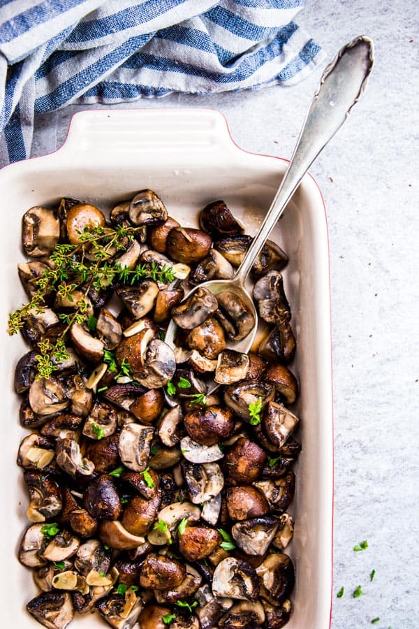 Garlic Butter Mushrooms in a Le Creuset casserole dish.