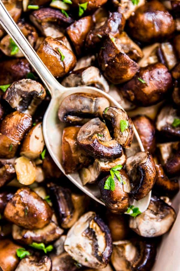 Garlic Butter Mushrooms with a spoon.