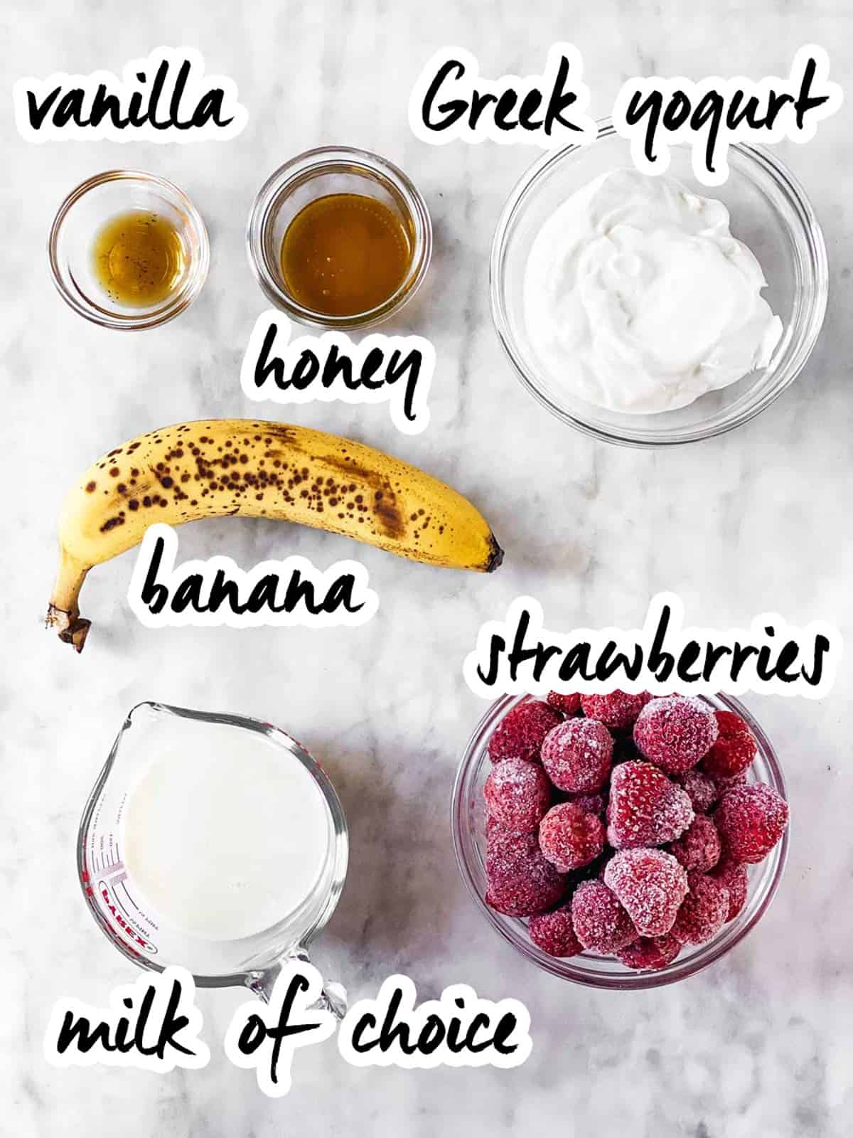 ingredients for strawberry banana smoothie with text labels