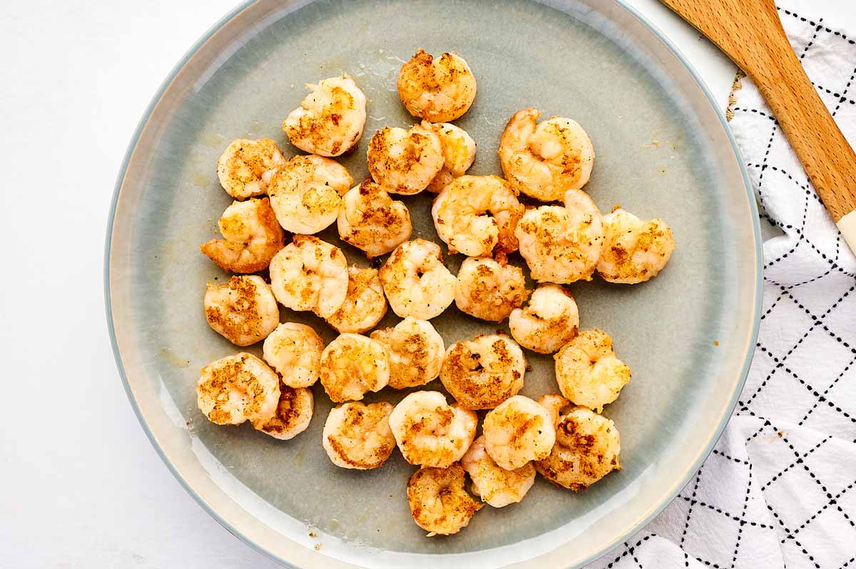 Seared shrimp on a plate.