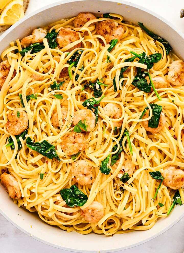 Skillet with garlic butter shrimp pasta.
