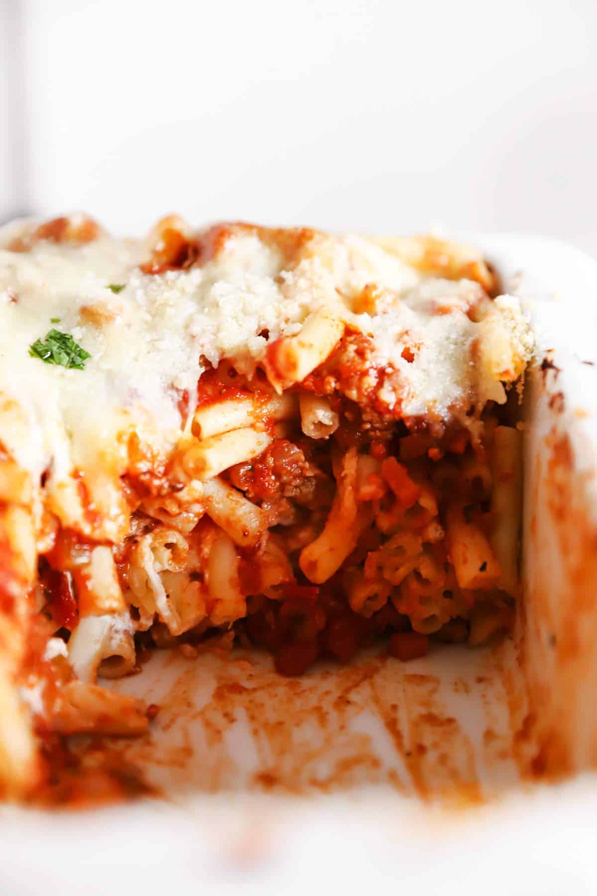 close up of baked ziti in casserole dish