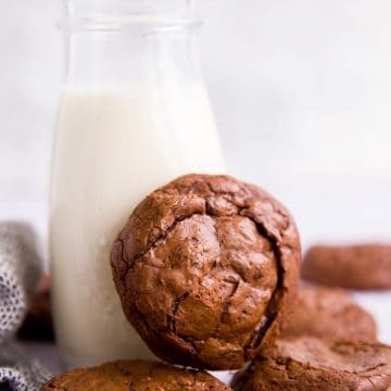 brownie cookies around a bottle of milk