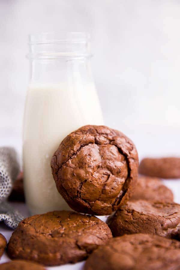 brownie cookies around a bottle of milk