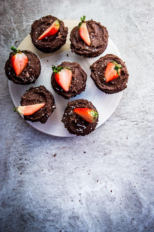 Seven easy chocolate cupcakes on a serving platter.